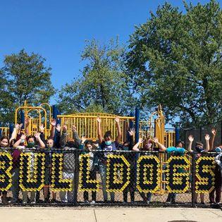 5th graders after installing fence art